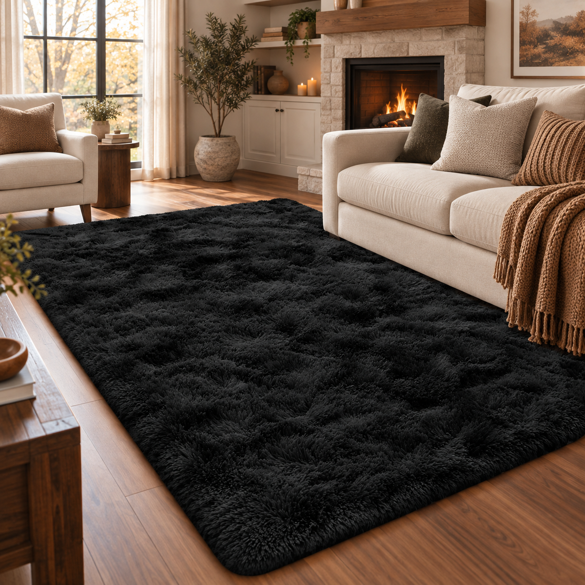 A large, plush black shag area rug styled in a cozy living room with a cream sofa, fireplace, wooden floors, and neutral decor.
