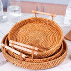 Set of woven baskets with handles on a light surface